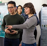 Two participants at a poster presentation