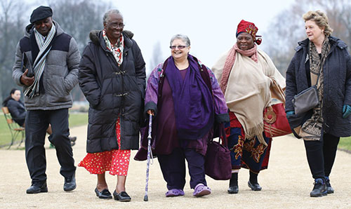 Members of the community walking together in the park