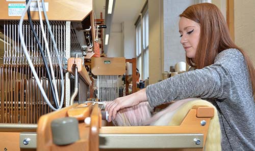 PGR student working a loom